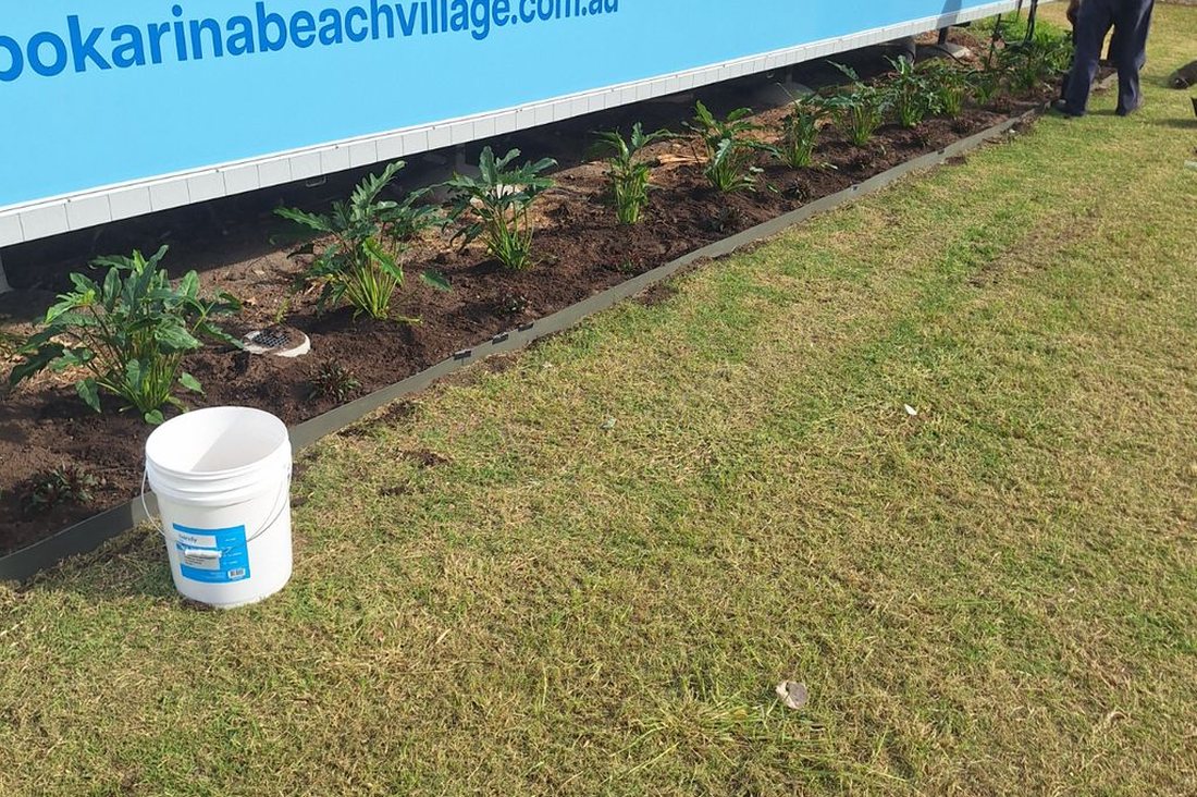 Bokarina Beach Village — Grolife crew member working on a fresh planting bed at the Bokarina Beach Village display